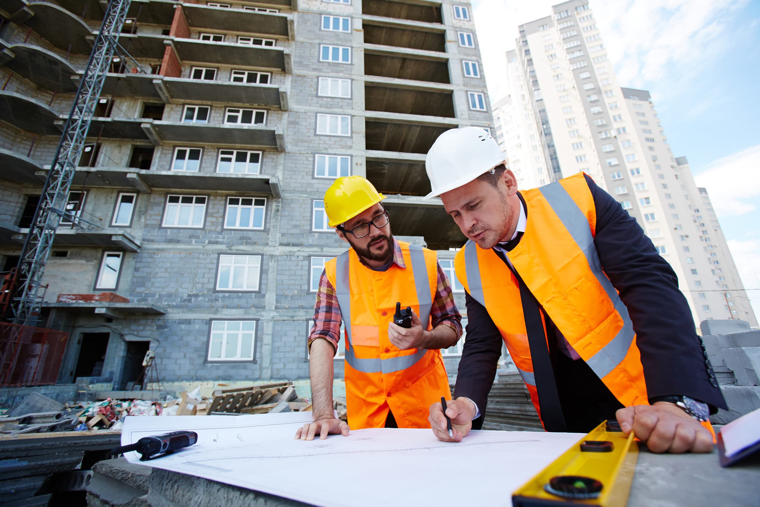 Architects reviewing blueprints for a LineaForte project
